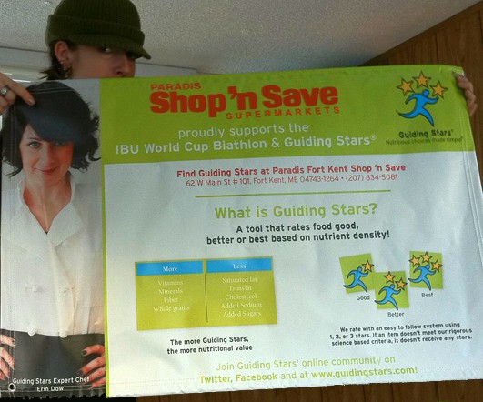 Erin holding Guiding Stars banner