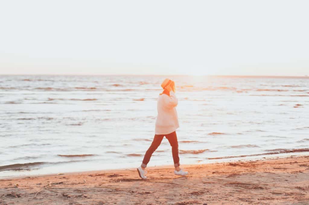 Woman walking on a beach