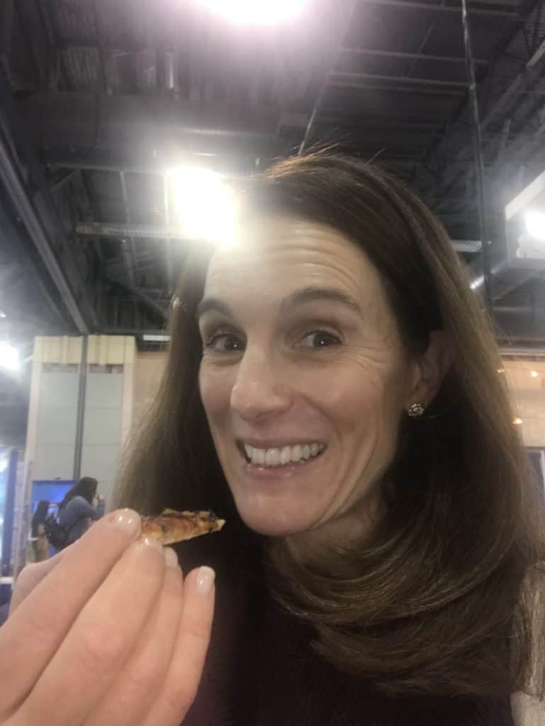 Allison Stowell smiles as she tastes a new food.