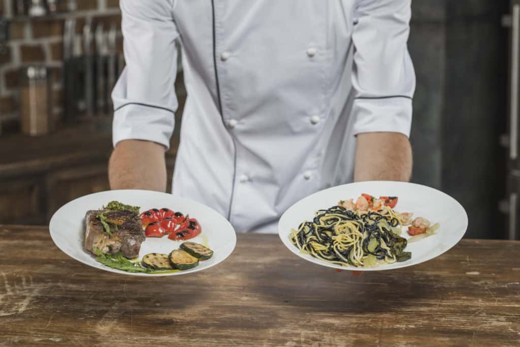 Chef presenting two plate options