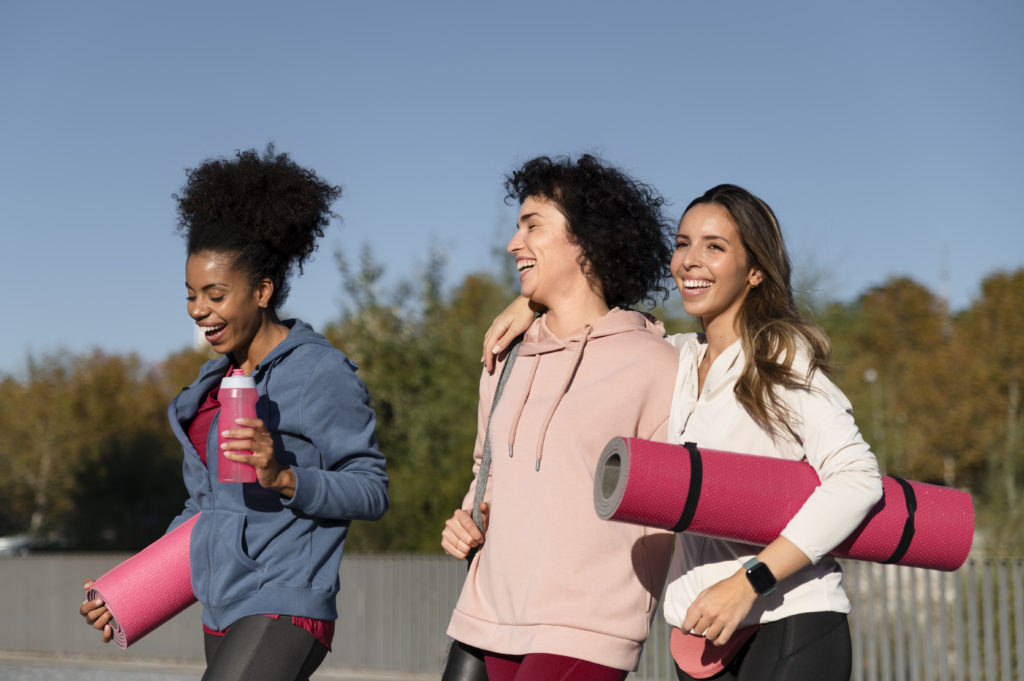 women with yoga mats