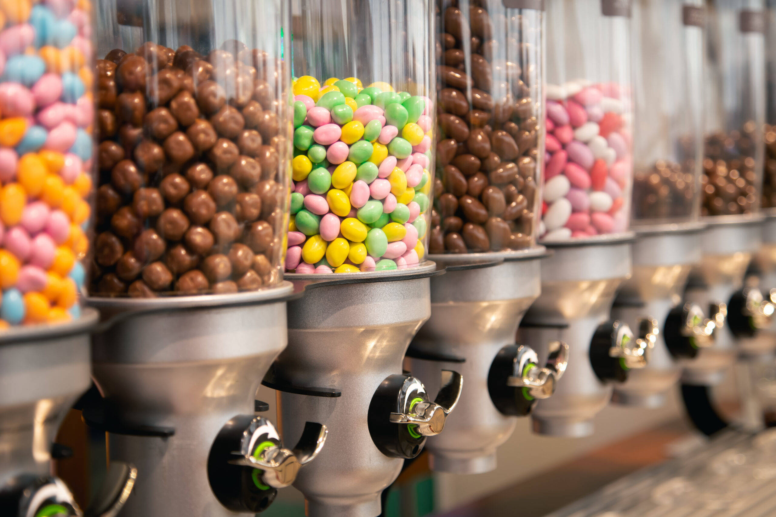 Bright candies in containers by weight in a candy store