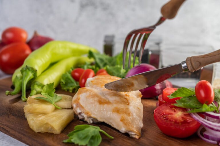 Chicken steak placed on a wooden tray